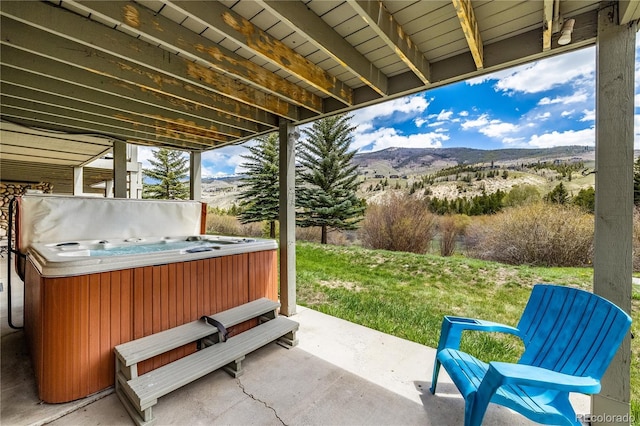 133 Creek Ln, Silverthorne, CO 80498 - view of patio / terrace with a hot tub and a mountain view