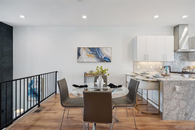 dining room featuring light hardwood / wood-style flooring