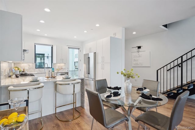 dining room with hardwood / wood-style flooring