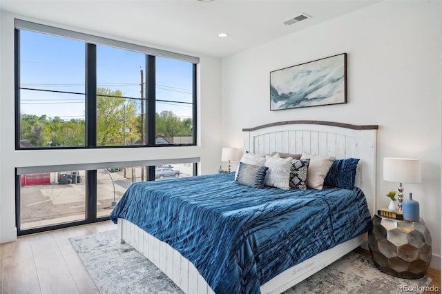 bedroom with light hardwood / wood-style flooring