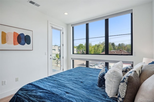 bedroom with wood-type flooring