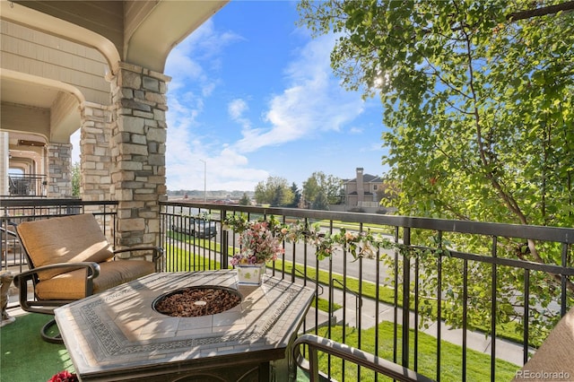 balcony featuring an outdoor fire pit