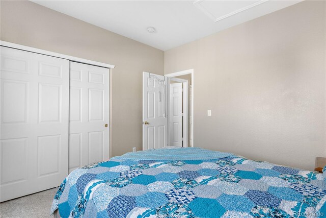 bedroom featuring a closet and carpet