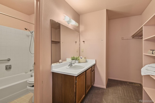 bathroom with vanity and tiled shower / bath combo