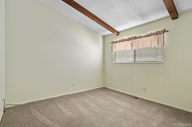 carpeted spare room featuring a textured ceiling and vaulted ceiling with beams