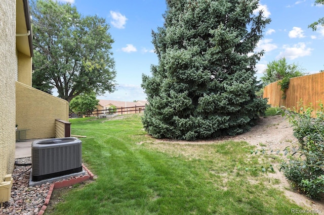 view of yard featuring central AC