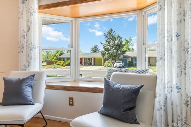 5593 E Center Ave, Denver, CO 80246 - sitting room featuring wood finished floors and baseboards