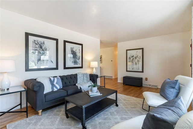 5593 E Center Ave, Denver, CO 80246 - living area featuring wood finished floors and baseboards