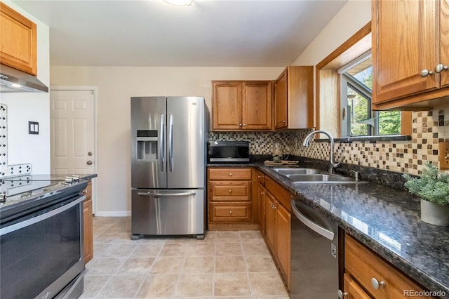 5593 E Center Ave, Denver, CO 80246 - kitchen with appliances with stainless steel finishes, a sink, and brown cabinetry