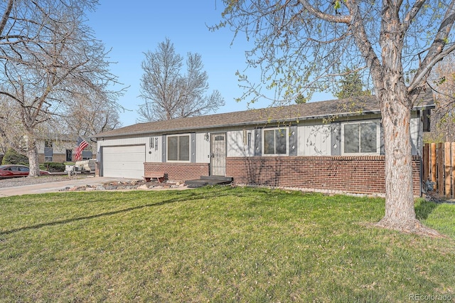 ranch-style home with a garage, concrete driveway, a front lawn, and brick siding
