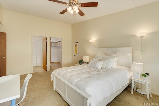 carpeted bedroom featuring baseboards and a ceiling fan
