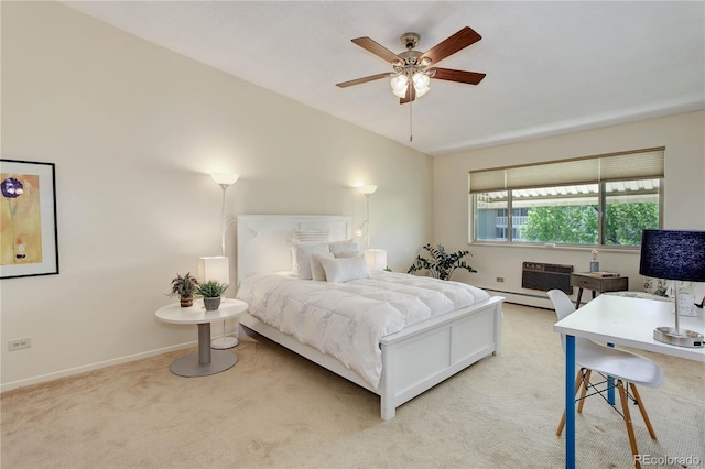 bedroom featuring light colored carpet, vaulted ceiling, baseboards, a baseboard heating unit, and ceiling fan