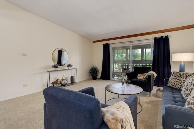 carpeted living area with baseboards and lofted ceiling