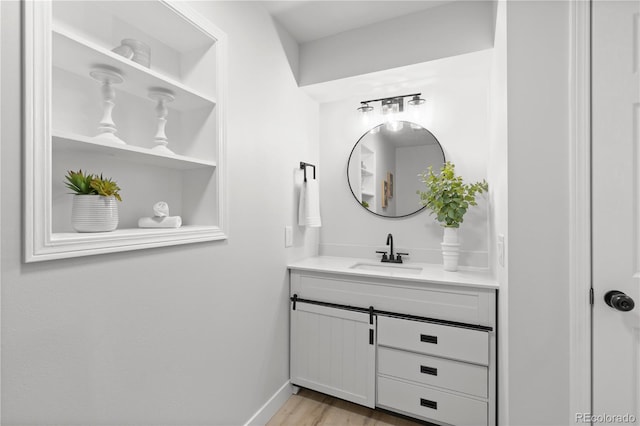 bathroom with vanity and wood-type flooring