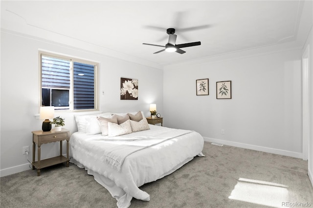 bedroom featuring light carpet, ceiling fan, and ornamental molding