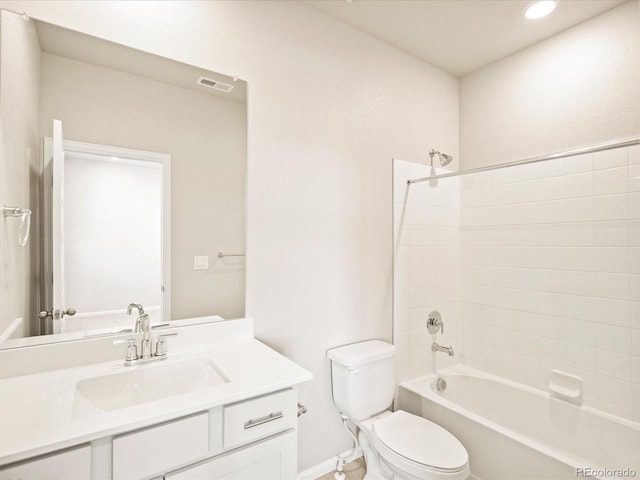 bathroom with visible vents, toilet, vanity, baseboards, and bathtub / shower combination