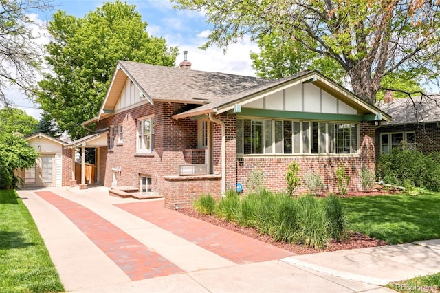 1767 S Sherman St, Denver, CO 80210 - view of front of house with board and batten siding, an outbuilding, brick siding, and a chimney