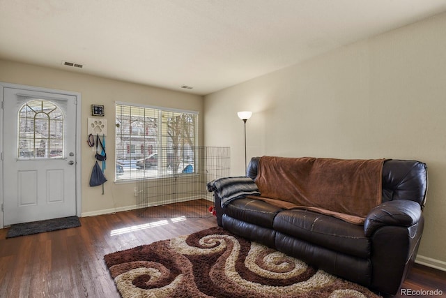 living room with dark hardwood / wood-style floors