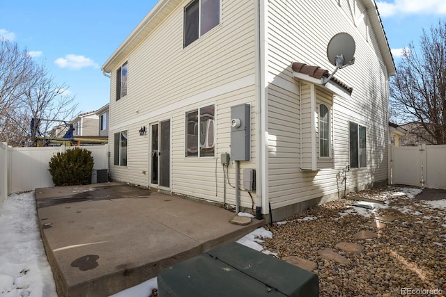 view of property exterior with central AC and a patio area