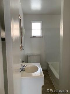 1265 Yates St, Denver, CO 80204 - full bath with vanity and a tub to relax in