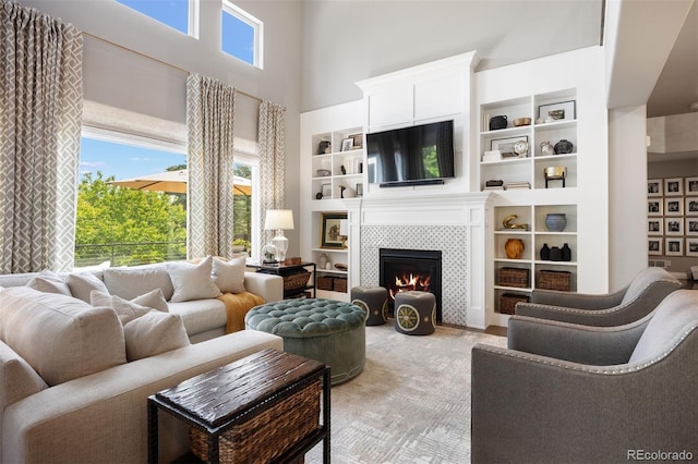 6175 Puma Sands, Lone Tree, CO 80124 - living room with a tile fireplace, built in features, and a high ceiling
