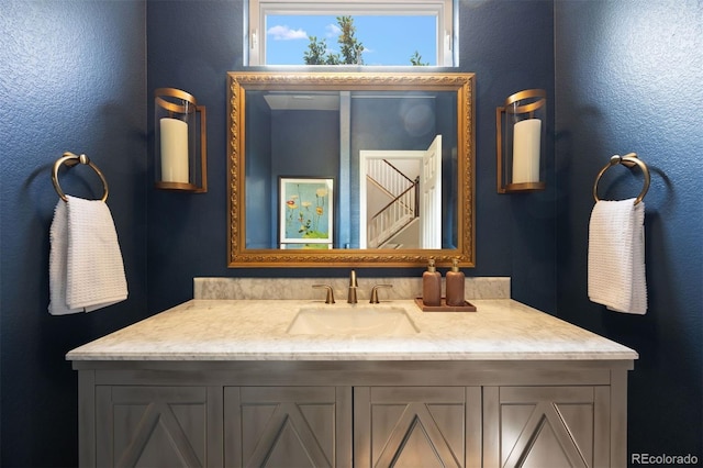 6175 Puma Sands, Lone Tree, CO 80124 - bathroom featuring vanity and a textured wall