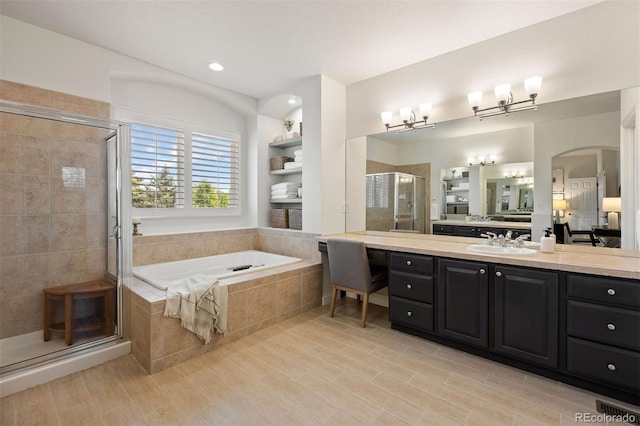 6175 Puma Sands, Lone Tree, CO 80124 - bathroom featuring a bath, vanity, and a stall shower