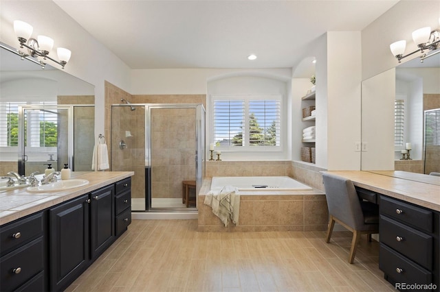 6175 Puma Sands, Lone Tree, CO 80124 - full bathroom featuring vanity, a bath, healthy amount of natural light, and a stall shower