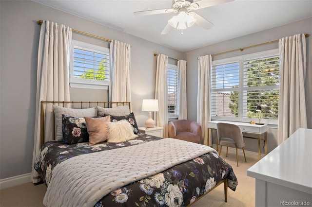 6175 Puma Sands, Lone Tree, CO 80124 - bedroom with multiple windows, light colored carpet, baseboards, and ceiling fan