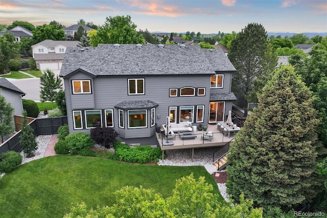 6175 Puma Sands, Lone Tree, CO 80124 - back of property at dusk with an outdoor living space and a deck
