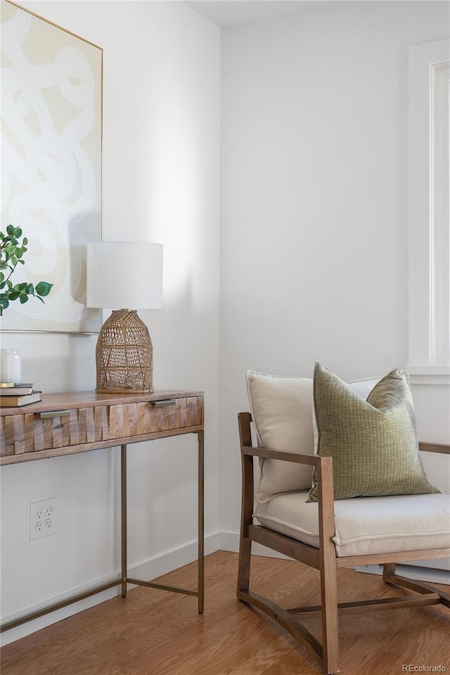 sitting room with hardwood / wood-style floors