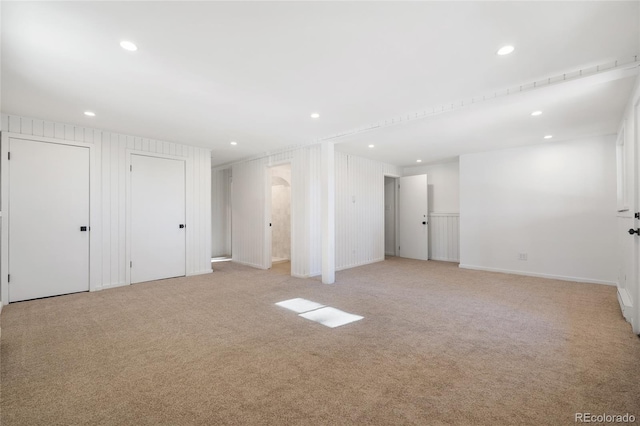 unfurnished room with light colored carpet