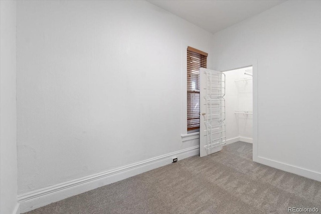 1103 Lipan St, Denver, CO 80204 - empty room featuring carpet flooring and baseboards