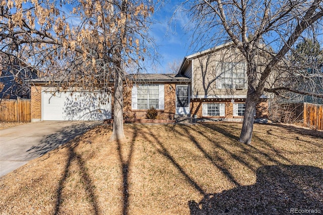 view of front of property with a garage and a front lawn