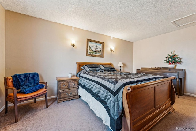 bedroom with carpet and a textured ceiling