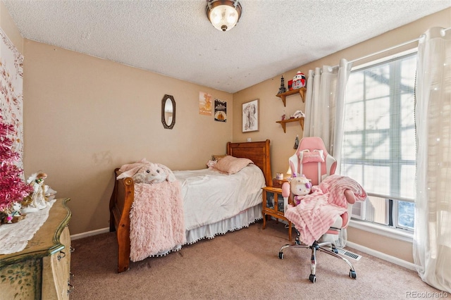 bedroom with carpet flooring and a textured ceiling