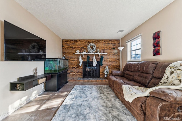 living room featuring a textured ceiling and a brick fireplace