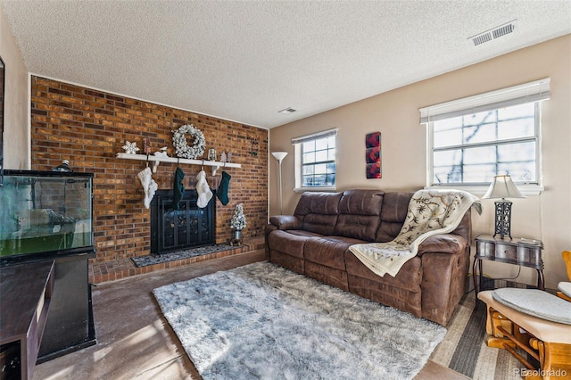 carpeted living room featuring a textured ceiling and a fireplace