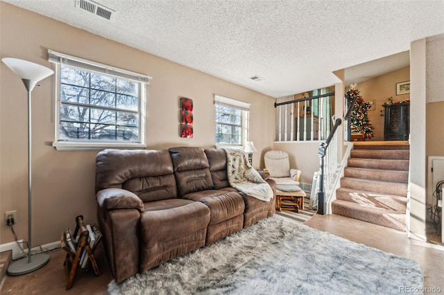 living room with a textured ceiling