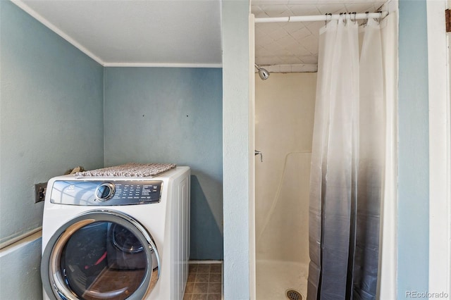 clothes washing area featuring washer / clothes dryer and ornamental molding