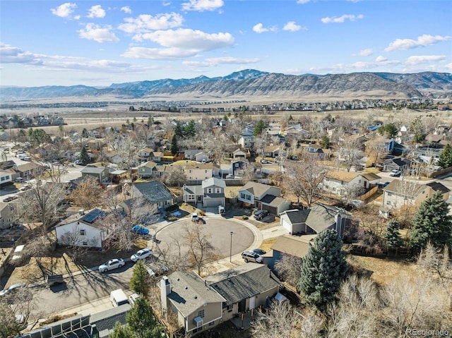 birds eye view of property featuring a mountain view