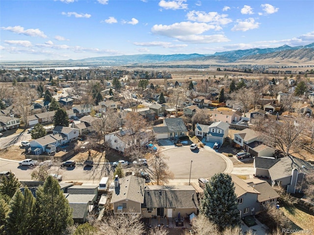 birds eye view of property with a mountain view