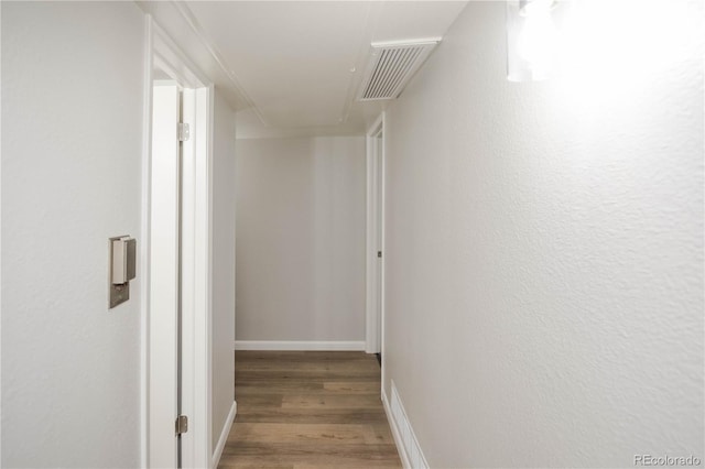 3855 S Monaco St Unit 208, Denver, CO 80237 - hallway with attic access and wood finished floors