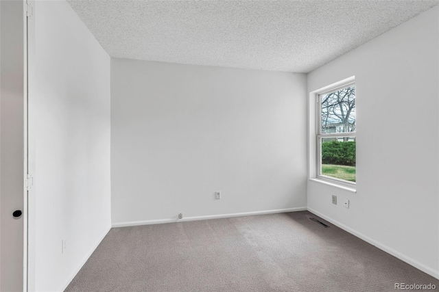 4248 Corriente Pl, Boulder, CO 80301 - unfurnished room featuring a textured ceiling, carpet flooring, and baseboards