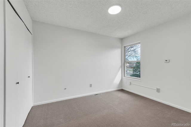 4248 Corriente Pl, Boulder, CO 80301 - unfurnished bedroom featuring dark colored carpet, a textured ceiling, a closet, and baseboards