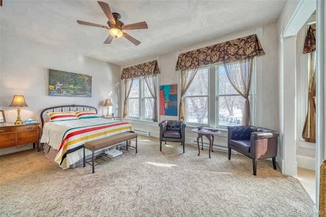 bedroom with ceiling fan and carpet flooring