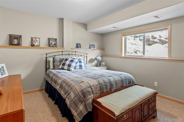 bedroom with light colored carpet