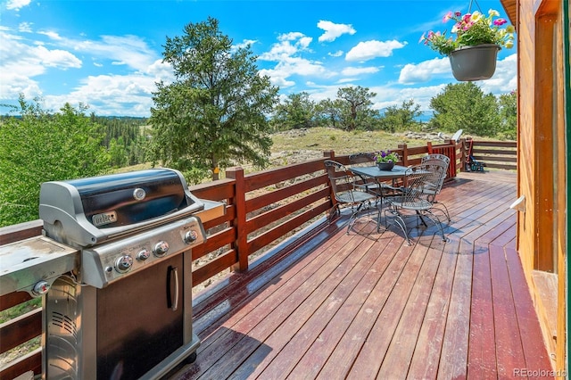 wooden terrace featuring grilling area