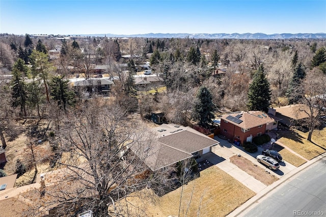 aerial view with a mountain view and a view of trees