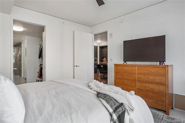 1750 Wewatta St Unit 525, Denver, CO 80202 - carpeted bedroom with ensuite bath and a ceiling fan